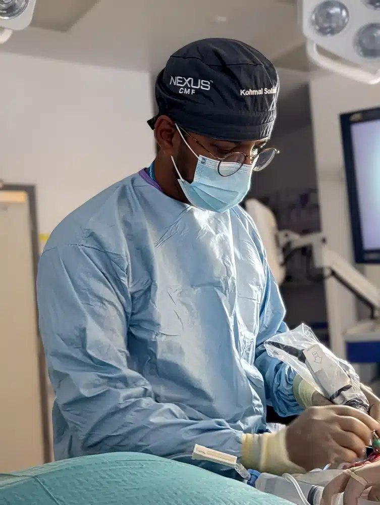 Mr Kohmal Solanki operating in theatre